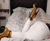 BWB MissBigButt modeling her collection of boots in white freddy pants and black shiny latex corsage in bed from sexe bwb