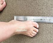TinySizedFeet Measuring against ruler and home items from nz maori