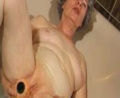 Granny masturbates with a vibrator in bathtub from granny masturbates with a dildo