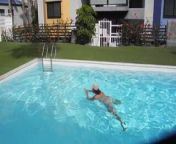 Adult woman bathing in the pool naked from swimming pool naked boy
