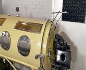 Latex gimp in the Iron Lung from www iron steel bdsm bondage torture woman com