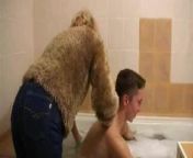 Older woman gives young man bath from old man bath with