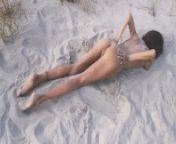 Amateur nudist teen fucks her tight pussy with a huge cucumber on a public beach. Ends with a pee. from voyeur pee