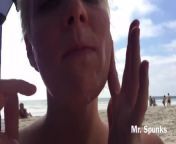 She Gives an Amazing Blow Job on a Public Nude Beach as People Walk By from nudesexy