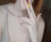 redhead girl smokes a cigarette from siberian bab