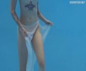Finnish babe swims nude in the pool from tiny nude