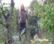 Redheaded Babe Pisses Long And Hard In Trees from voyeur pee